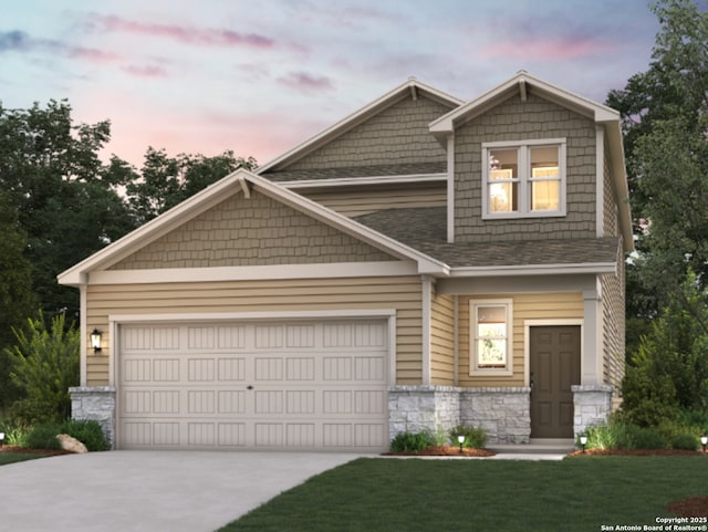 craftsman inspired home featuring a front lawn, stone siding, roof with shingles, an attached garage, and driveway