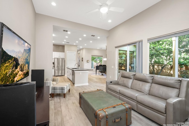 440 E Olmos, San Antonio, TX 78212 - living area with light wood-style flooring, ceiling fan, plenty of natural light, and recessed lighting