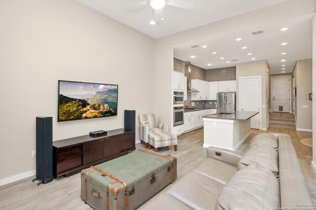 440 E Olmos, San Antonio, TX 78212 - living room featuring light wood finished floors, a ceiling fan, baseboards, and recessed lighting
