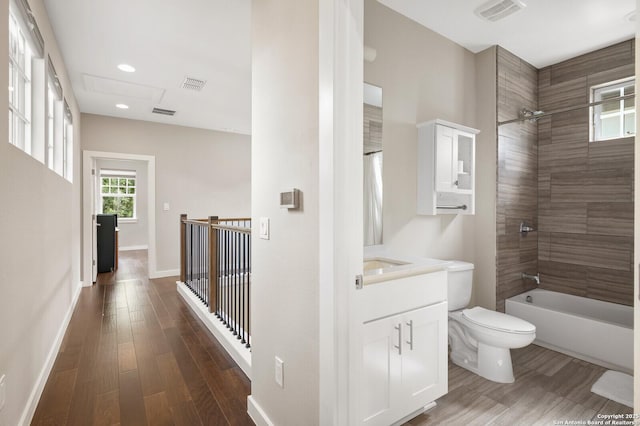 440 E Olmos, San Antonio, TX 78212 - full bath with toilet, wood finished floors, vanity, baseboards, and shower / bath combination