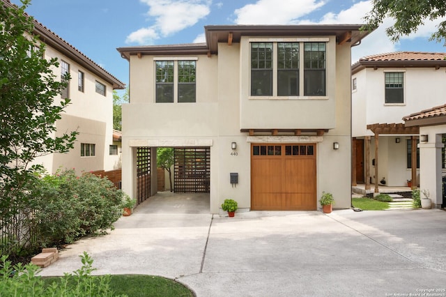 440 E Olmos, San Antonio, TX 78212 - view of front of home with driveway, stucco siding, and a garage