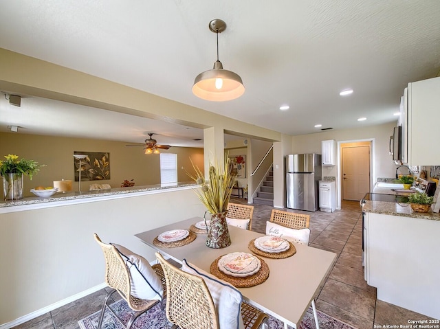 dining space with a ceiling fan, stairway, baseboards, recessed lighting, and light tile patterned flooring