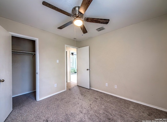 unfurnished bedroom featuring carpet floors, baseboards, and visible vents
