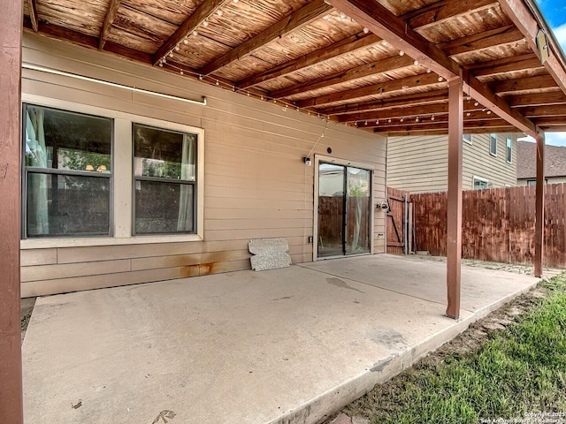 view of patio / terrace featuring fence
