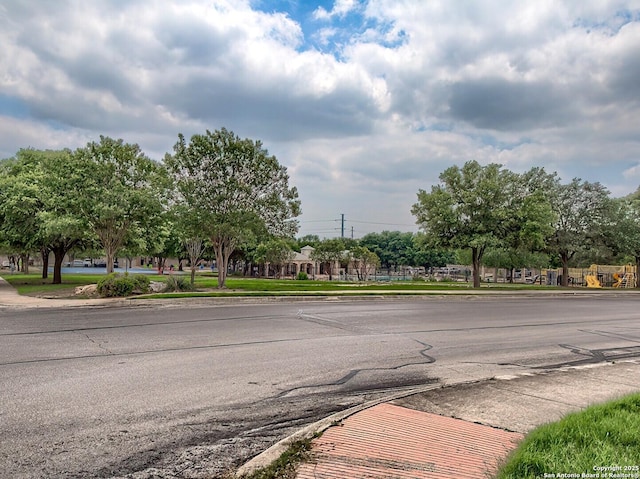 view of road featuring sidewalks and curbs