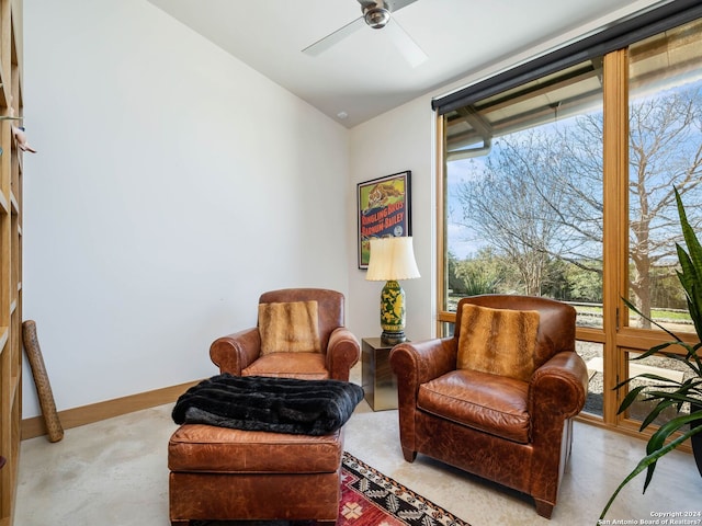 sitting room featuring a ceiling fan and vaulted ceiling