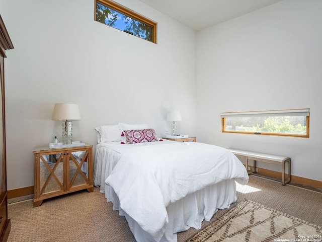 carpeted bedroom with baseboards