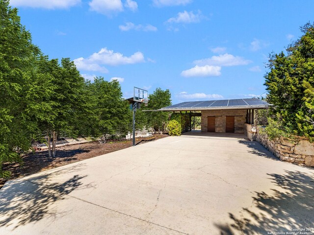 view of patio with concrete driveway