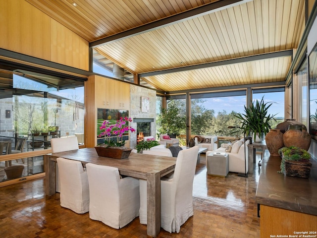 sunroom / solarium with plenty of natural light and beam ceiling