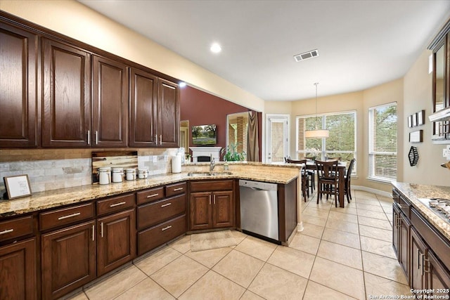 kitchen with light tile patterned flooring, dark brown cabinets, a sink, backsplash, and stainless steel dishwasher