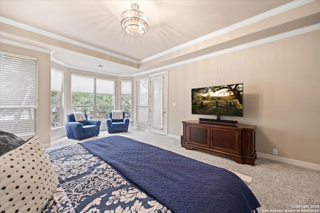 bedroom featuring carpet floors, ornamental molding, baseboards, and a tray ceiling