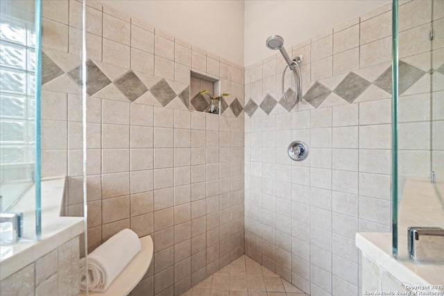 full bathroom featuring toilet and tiled shower