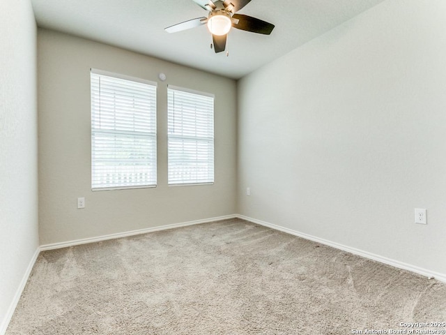 empty room featuring baseboards, carpet, and ceiling fan