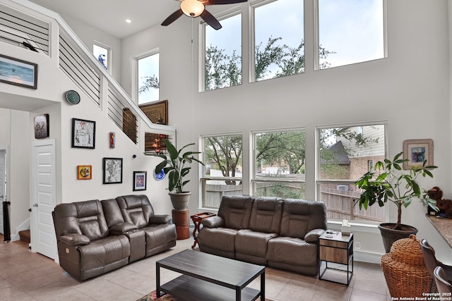 5707 Pin Pt, San Antonio, TX 78266 - living room featuring a ceiling fan, light tile patterned flooring, and a towering ceiling