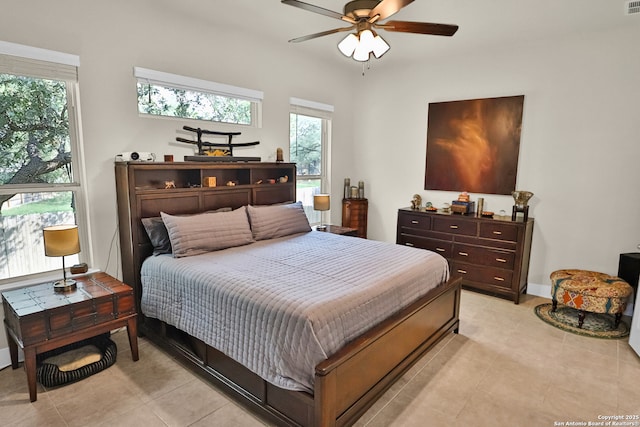 5707 Pin Pt, San Antonio, TX 78266 - bedroom with light tile patterned floors, baseboards, and ceiling fan