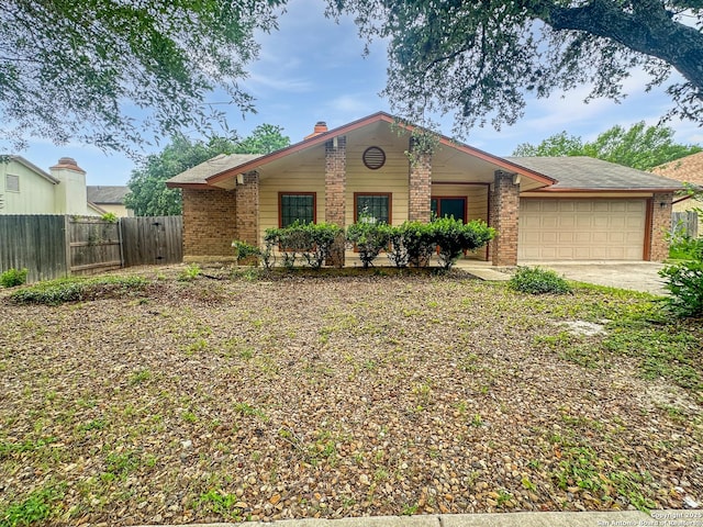 4826 Bohill, San Antonio, TX 78217 - single story home with fence, an attached garage, brick siding, and driveway