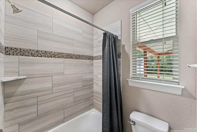 bathroom with toilet and shower / tub combo with curtain