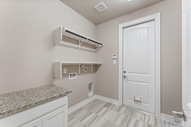 clothes washing area with washer hookup, laundry area, electric dryer hookup, visible vents, and baseboards