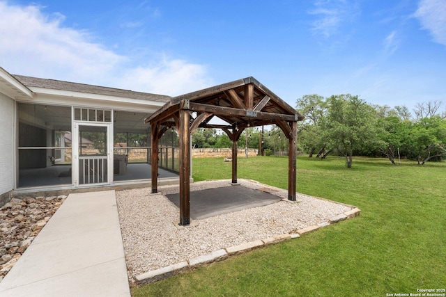 view of yard with a patio, a gazebo, and a sunroom