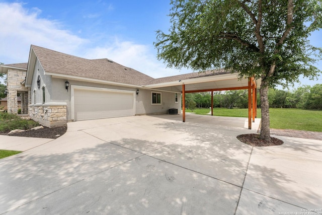 view of front of house featuring an attached garage, a front lawn, stone siding, cooling unit, and concrete driveway