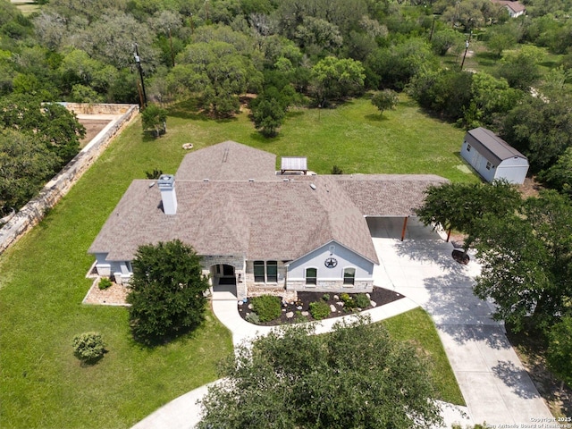 drone / aerial view with a view of trees
