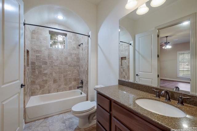 full bathroom featuring vanity, ceiling fan, shower / bathing tub combination, and toilet
