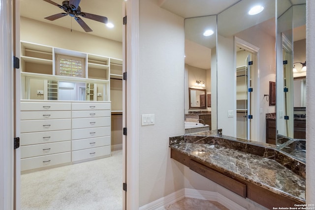 bathroom featuring vanity, a ceiling fan, recessed lighting, and a spacious closet