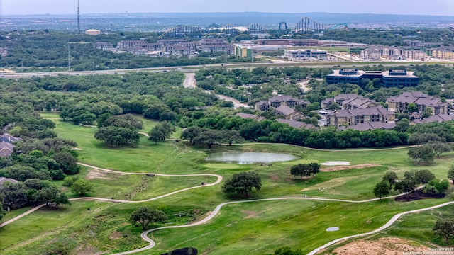 aerial view featuring a water view and golf course view