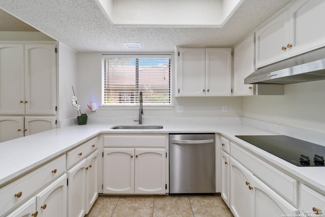 kitchen with stainless steel dishwasher, black electric stovetop, under cabinet range hood, white cabinets, and a sink