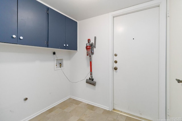 laundry room with baseboards, hookup for a washing machine, and cabinet space