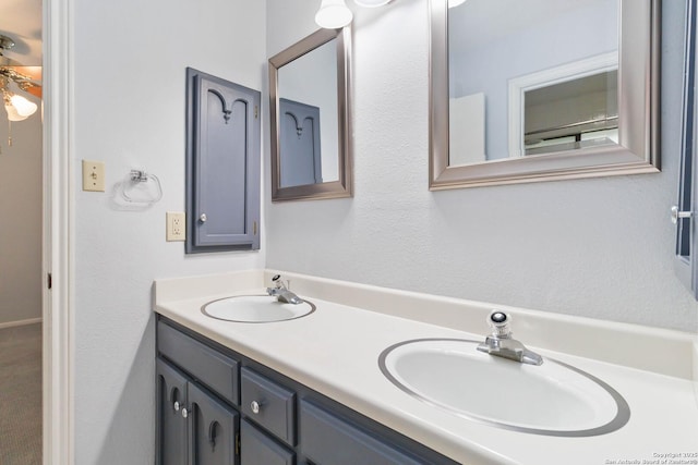 full bath featuring a sink and double vanity