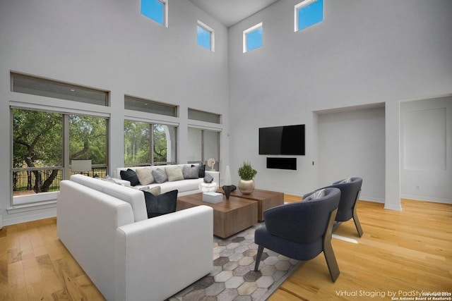 22932 Estacado, San Antonio, TX 78261 - living area with a high ceiling, light wood finished floors, and baseboards