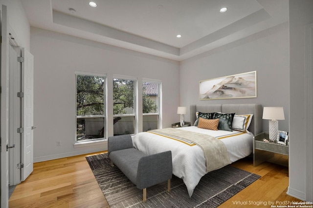 22932 Estacado, San Antonio, TX 78261 - bedroom featuring a tray ceiling, light wood-type flooring, recessed lighting, and baseboards