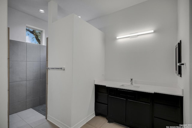 22932 Estacado, San Antonio, TX 78261 - bathroom with vanity, tile patterned floors, baseboards, and walk in shower