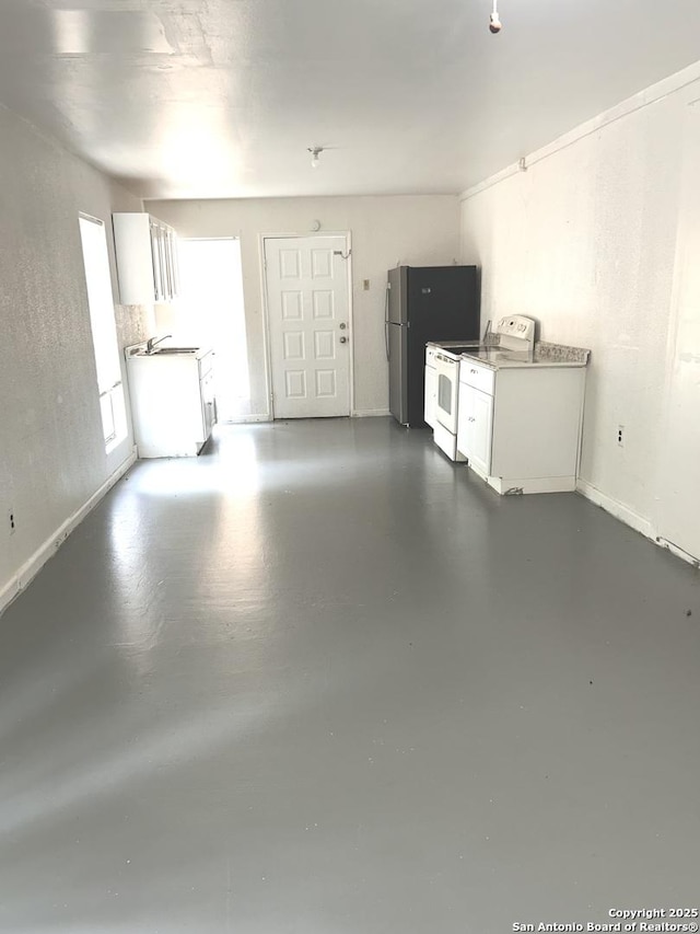 garage featuring baseboards