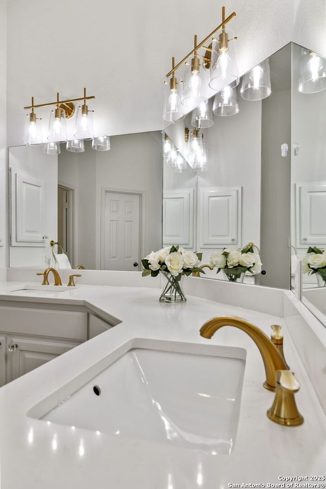 bathroom featuring double vanity and a sink