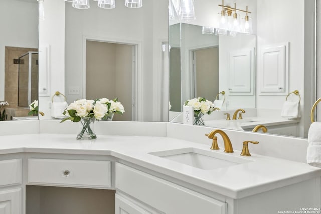 full bathroom featuring a shower stall and vanity