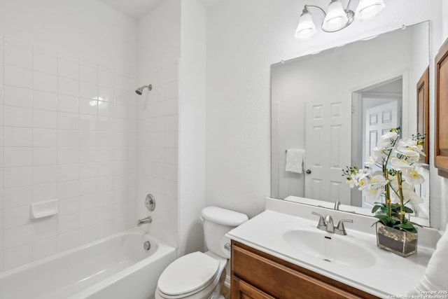 bathroom featuring toilet, bathing tub / shower combination, and vanity