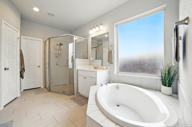 full bath with a garden tub, visible vents, a stall shower, vanity, and recessed lighting