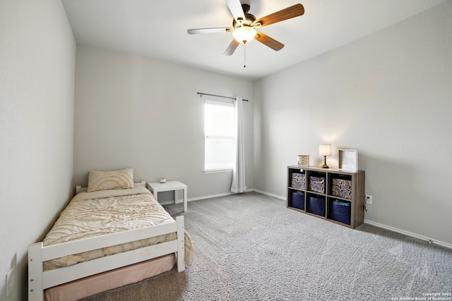carpeted bedroom with baseboards and a ceiling fan