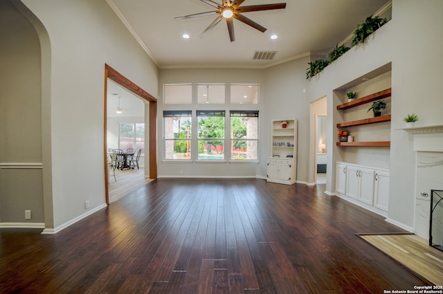 unfurnished living room with a ceiling fan, visible vents, ornamental molding, recessed lighting, and dark wood-type flooring