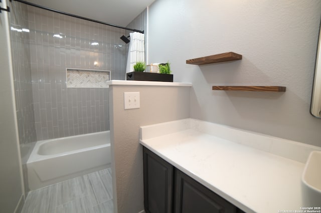 bathroom with vanity and bathing tub / shower combination