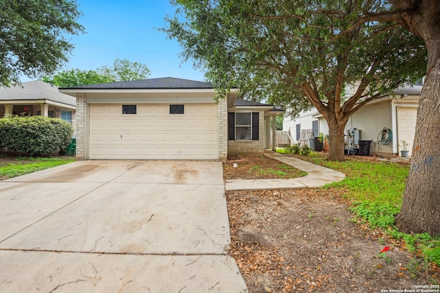 ranch-style house featuring concrete driveway, brick siding, and a garage