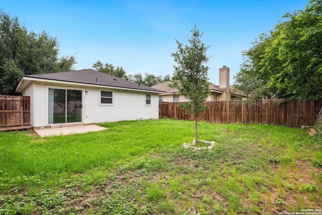 view of yard with a patio and a fenced backyard