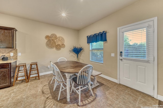 dining room featuring baseboards