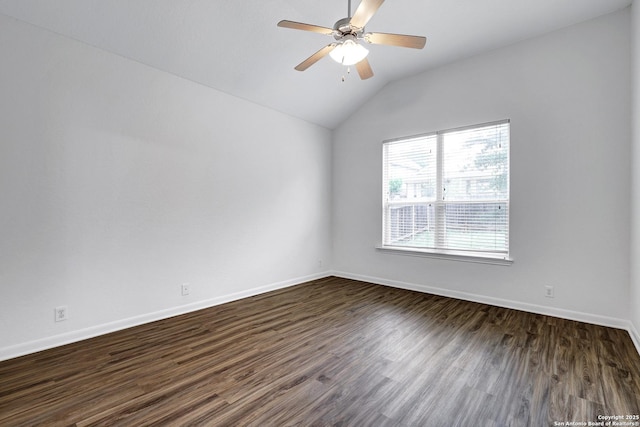 unfurnished room featuring dark wood-type flooring, baseboards, ceiling fan, and lofted ceiling