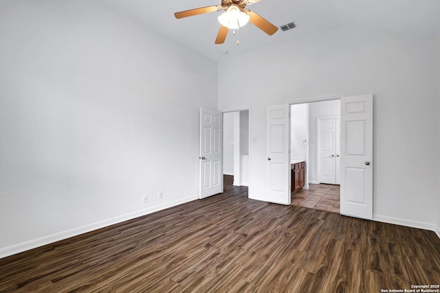 unfurnished bedroom featuring visible vents, baseboards, ceiling fan, high vaulted ceiling, and dark wood finished floors