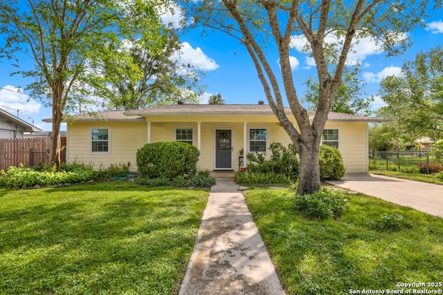 single story home featuring fence and a front yard