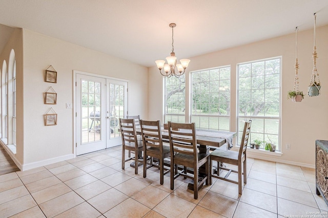 dining room featuring a chandelier, plenty of natural light, and light tile patterned floors