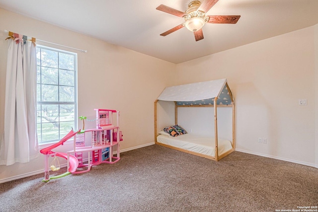 rec room with baseboards, carpet, and a ceiling fan